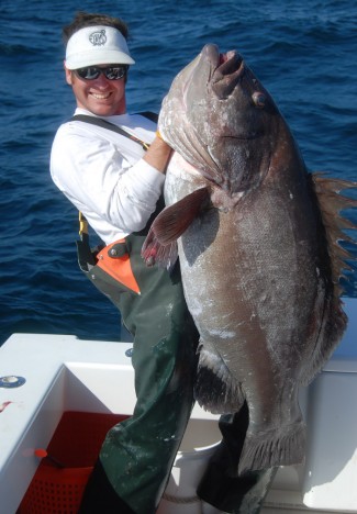 captain billy wells photo with warsaw grouper.
