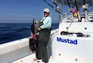 yellowfin tuna with shark bite photo. MGFC. Kevin Beach