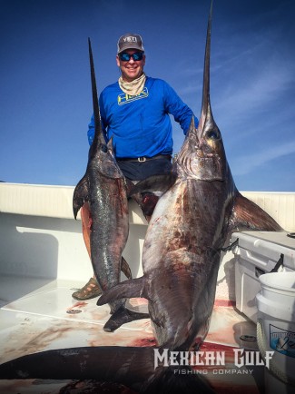 swordfish photo. Two swords with Capt. Billy Wells, MGFC. Venice, LA